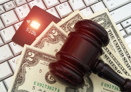 Judge gavel, credit card and money on computer keyboard. Online banking, law and legal concept