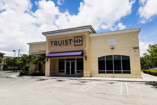 Miami, FL - July 2nd 2022: A Truist bank is seen with an empty parking lot as less consumers are trusting the financial system.