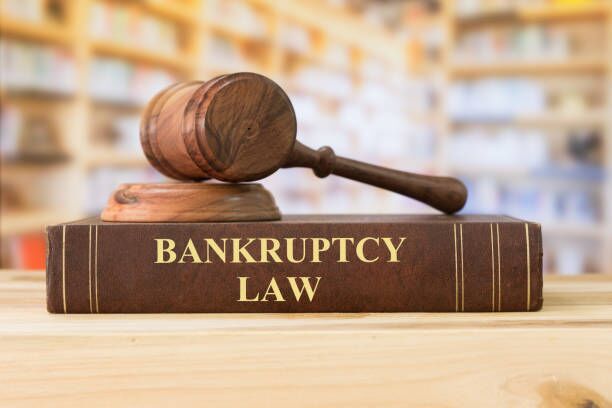 Bankruptcy Law book on a desk with a gavel sitting on top