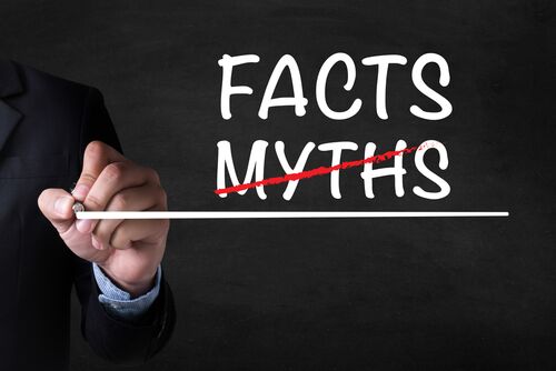 FACTS - MYTHS , Businessman drawing Page on blackboard