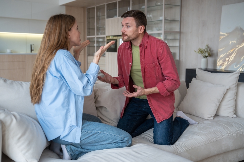 Man woman quarrel over internet addiction and hanging in phone long time. Tired upset wife asking husband take his mind off smartphone. Marital discord, couple relationships, emotional conversation.