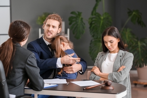 child with the divorcing parents communicating with lawyer