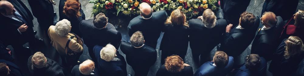 A group of people at funeral with an executor